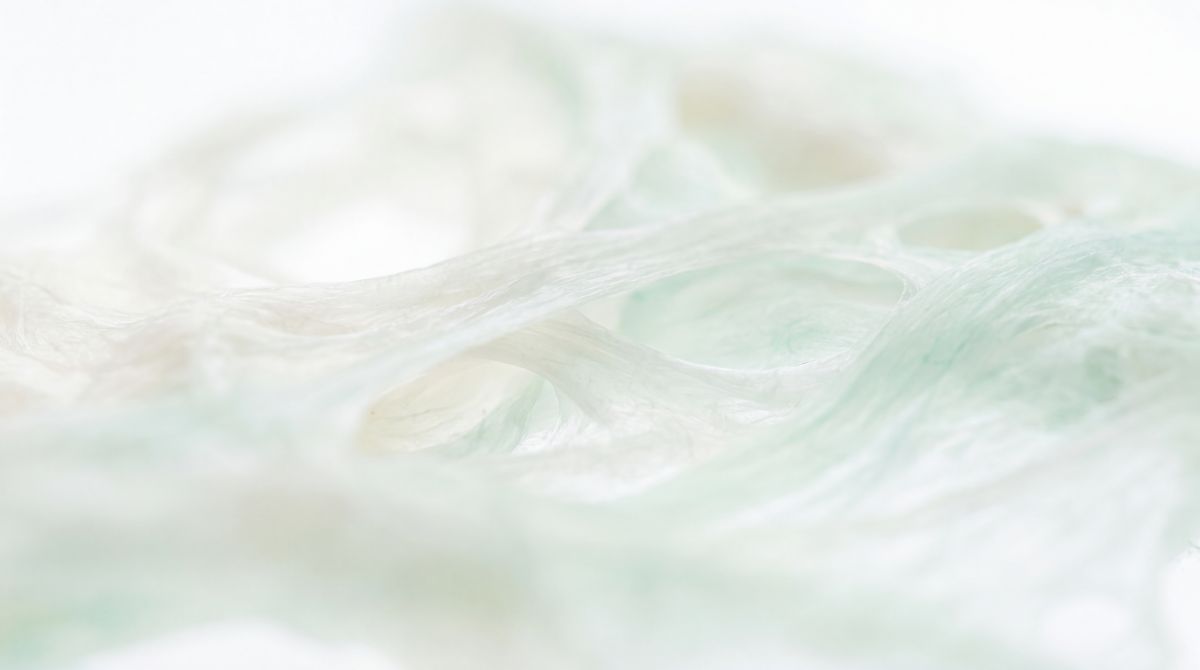 Macro abstracto de fibra en blanco y menta